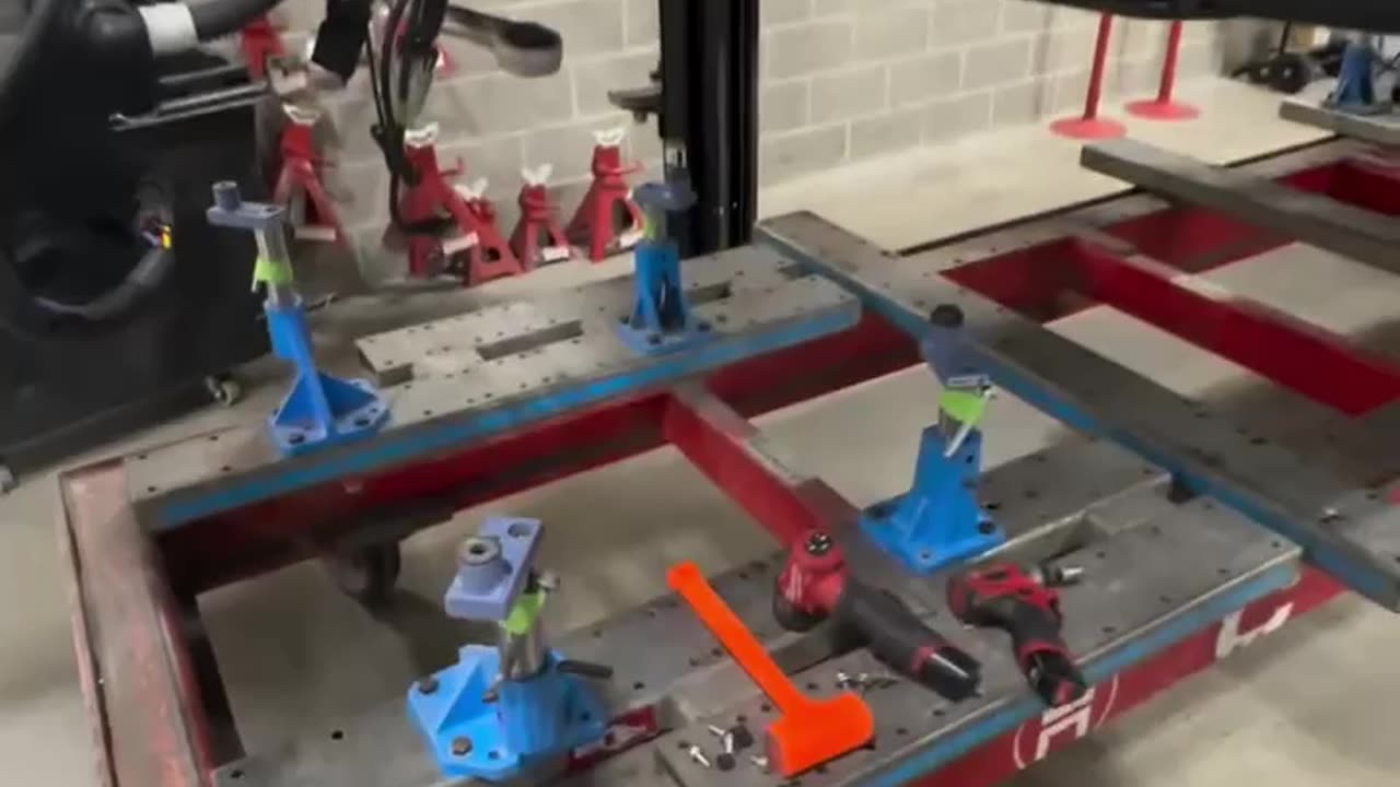 Tesla model 3 mounted on the Celette bench to ensure everything lines up correctly.