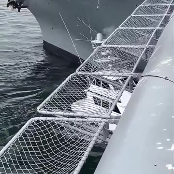 A civilian fishing boat collides with the USS Midway in San Diego, California