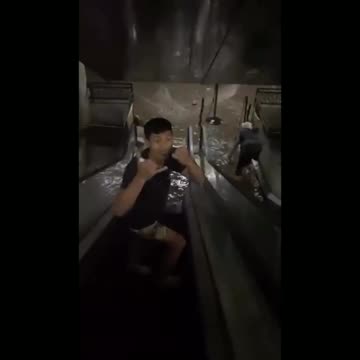 Floodwaters are pouring into an underground basement, leaving some people stuck in Bali, Indonesia