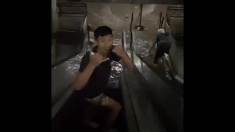 Floodwaters are pouring into an underground basement, leaving some people stuck in Bali, Indonesia