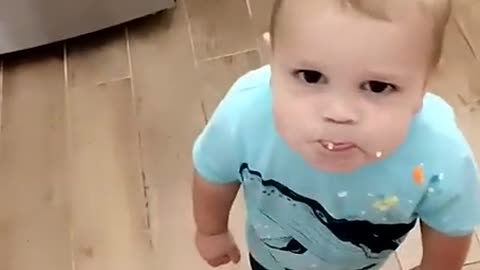 Baby wants cream for his furry friend