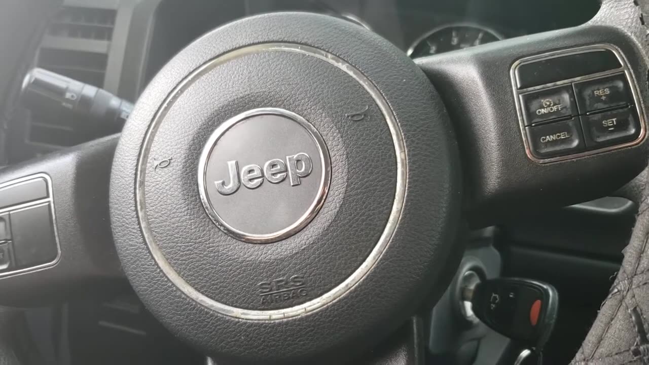 How to adjust the clock in a Jeep Liberty