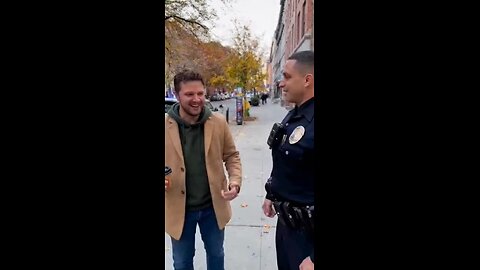 Police officers arrest a man for patting him on the back