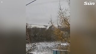 Moment Russian military transport plane breaks apart in midair before plummeting to the ground