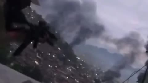 A member of "Red Command" opening fire against Brazilian Police
