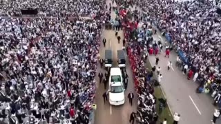 Massive crowds gather in Lebanon to see Pope Leo XIV arrive in the popemobile.
