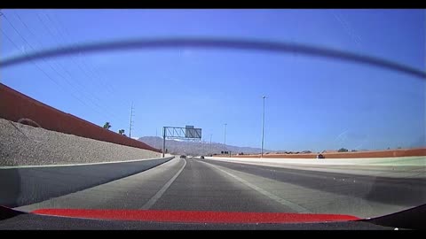 Car Turns Hard On Freeway Into Barricade