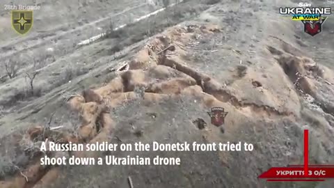 Heart-stopping moment Russian soldier opens fire on drone as explosion rocks trench