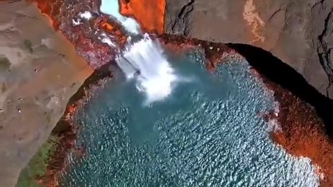 Caviahue, Argentina, Salto del Agrio is a 60 meter high waterfall, which drops to a small green pool