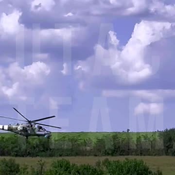 Incredible Footage of a Ukrainian Mi-24 Attack Helicopter Firing Rockets Through Drone Camera