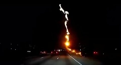 A driver on an Atlanta street narrowly avoids a lightning bolt.