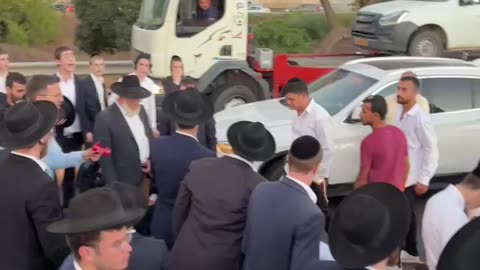 Fight breaks out as ultra-Orthodox Jews block road