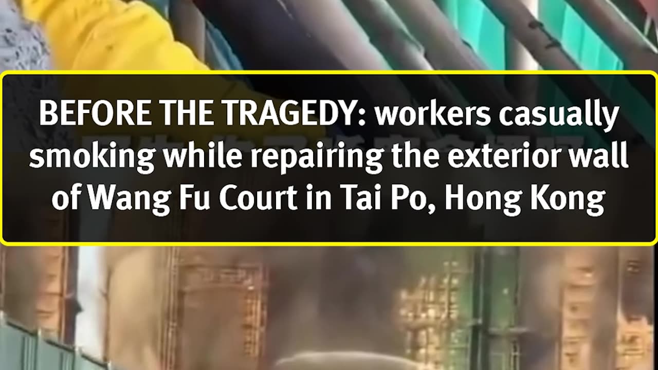 BEFORE THE TRAGEDY: Workers smoking informally while repairing the exterior wall of Wang Fu Court