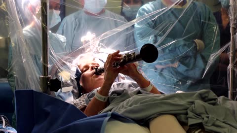Parkinson’s patient plays clarinet during brain operation in London