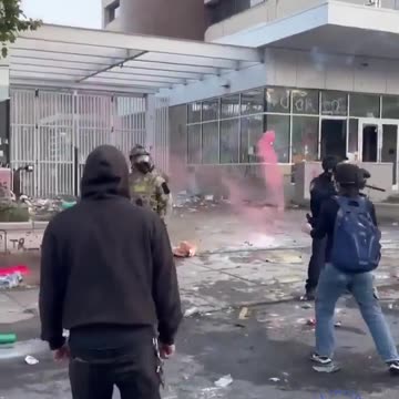 Protesters and Agents Outside of ICE facility