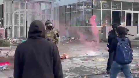 Protesters and Agents Outside of ICE facility