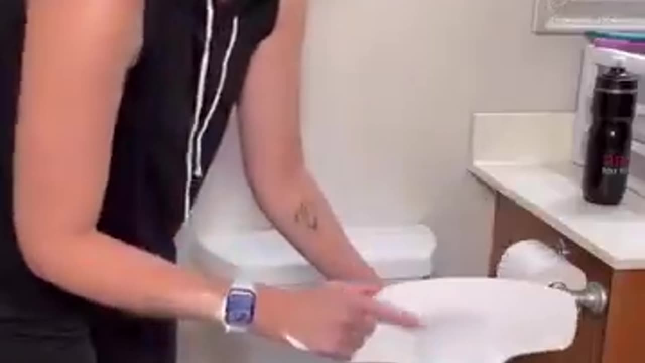 This toilet seat has a unique attachment