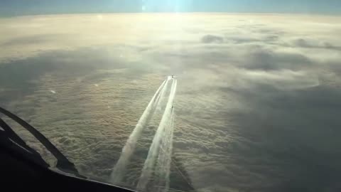 Three planes follow the same path in the sky over the Atlantic Ocean