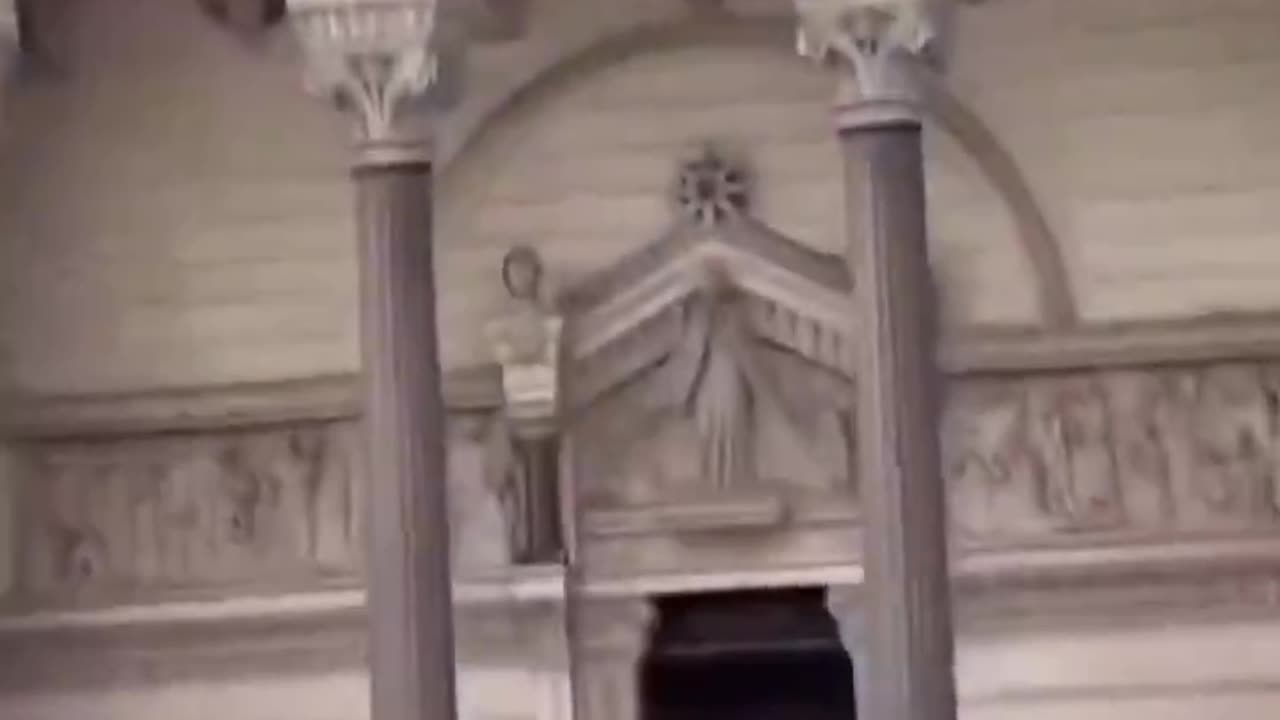 Usual suspect climbs without clothes on sculptures outside Lyon Cathedral, France.
