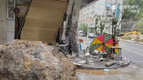 Huge boulder rolled down hill missing road users