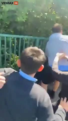 sandnigger muslim holds white kid and lets little migrant cocksuckers assault him in uk