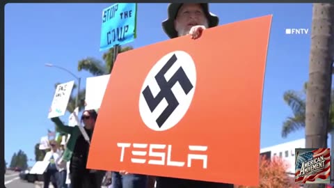 These protest are just stupid look at this guy with a swastika sign short clip