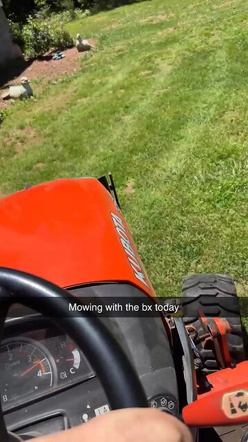 Bx2380 mowing the yard