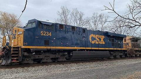 Freshly Painted CSX Train engine and a YN2 and an impatient man