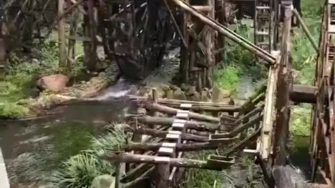 An old wooden watermill in China, a glimpse into traditional engineering still in use today.