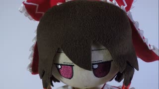 A Miko receives a gift from a Ball shaped cat