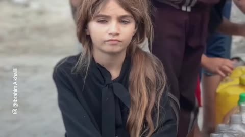 Scenes of children waiting for their turn in a queue to get water in the Gaza Strip