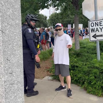 Police instruct protesters not to cover their faces.