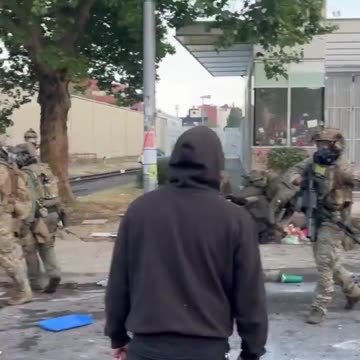 "war" on the streets of Portland. Feds v Black Bloc. Sign basher guy has been charged.