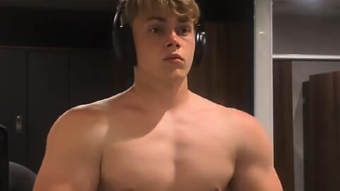 Teen boy flexing muscles
