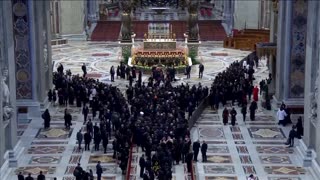 Pope Leo hugs his brother after his inaugural Mass