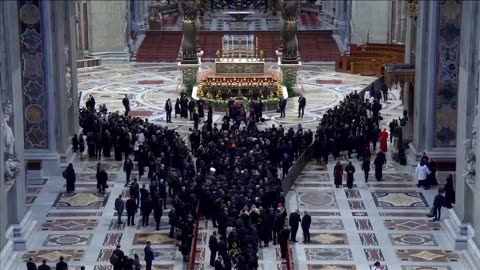 Pope Leo hugs his brother after his inaugural Mass