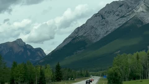 Scenic Drive Towards Majestic Mountain Range