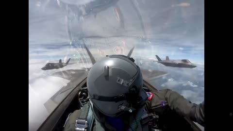 An F-22 Raptor flying with two F-35s before peeling off in an epic breakaway.