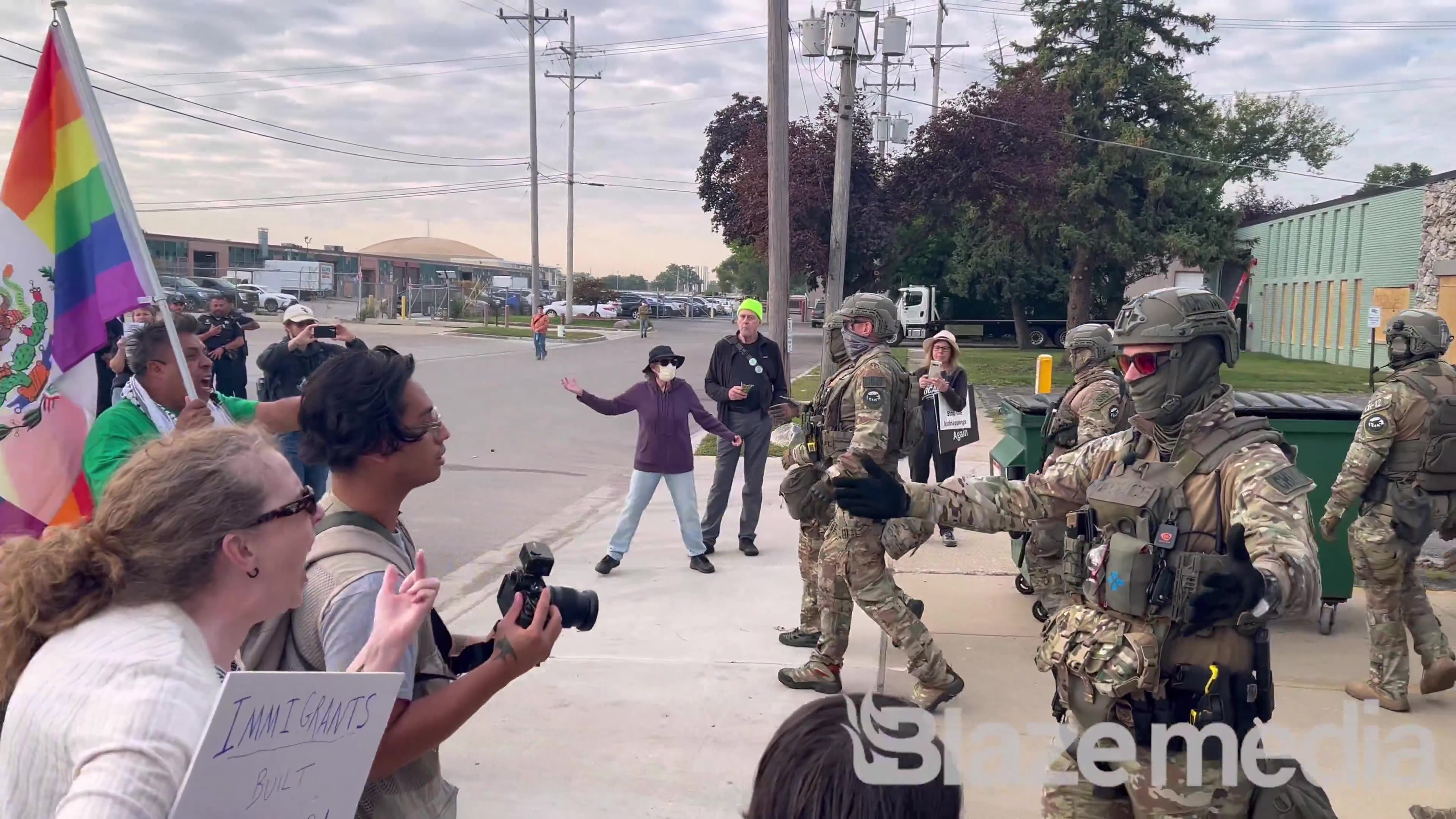 Anti-ICE protesters are blocking the road outside of the ICE building