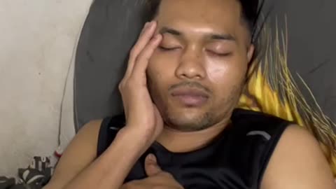 "Deep Slumber: A Man Lost in Peaceful Sleep"