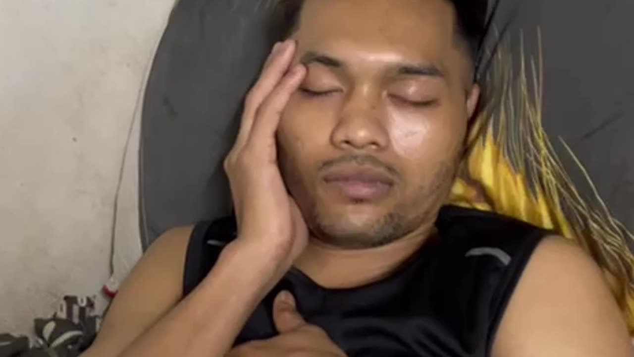 "Deep Slumber: A Man Lost in Peaceful Sleep"
