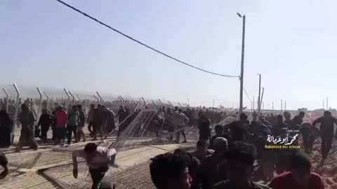 New footage from the moments of the break-in: gunshots in the background and breached fences