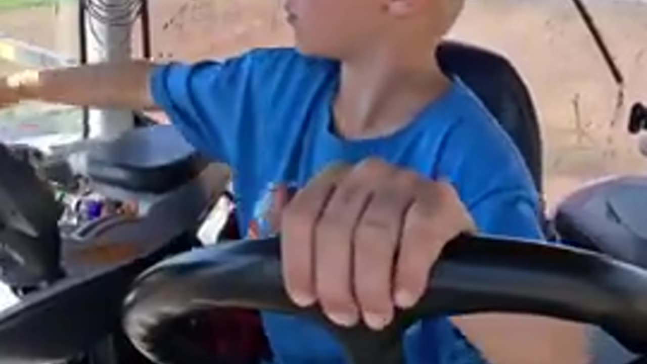 Just a kid operating a tractor