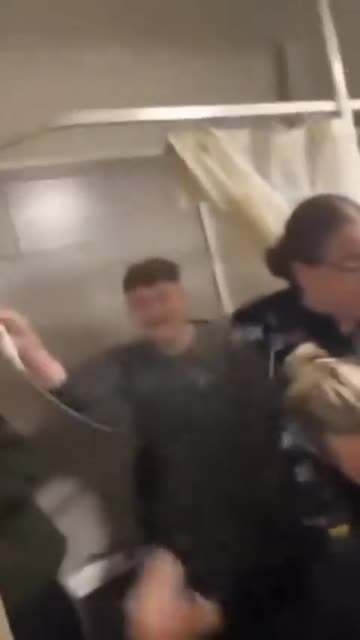 British police attempt to arrest a young man for his Facebook posts.