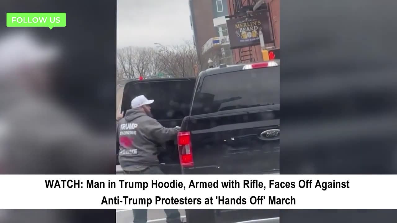 Trump Supporter with Rifle Confronts Protesters at March