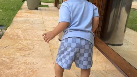 Kid Runs Into Trash Can and Falls Over