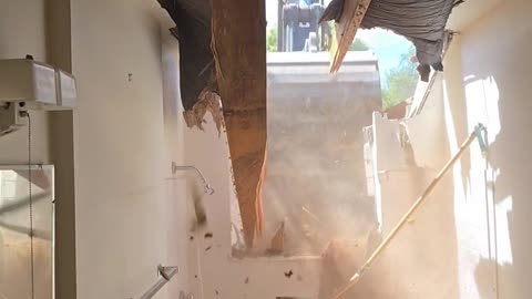 Excavator Bucket Bashes Hole in Bathroom Wall