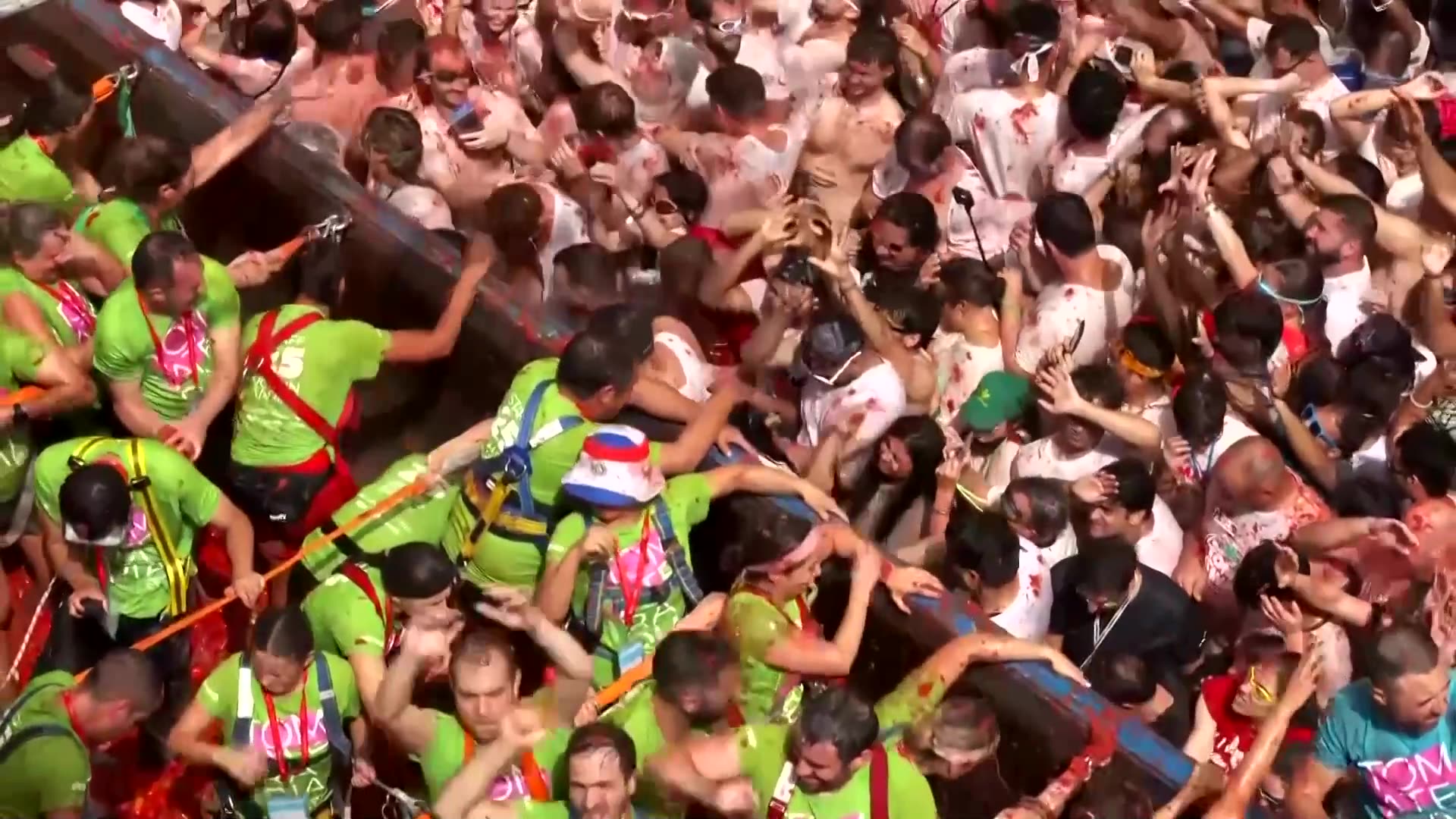 Revelers hurl tomatoes during Spanish food fight festival