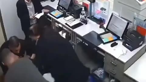 Hero steps in and takes out an armed robber