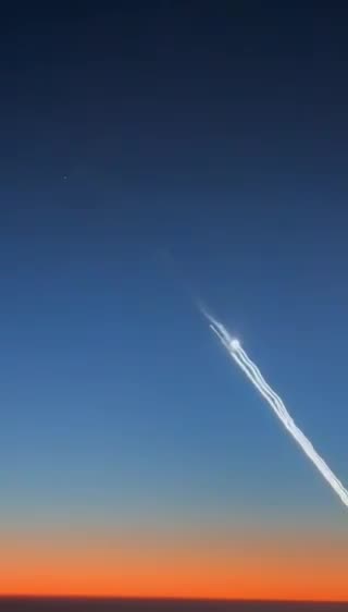 New video captured from airplane's cockpit shows Iranian ballistic missiles directed toward Israel.